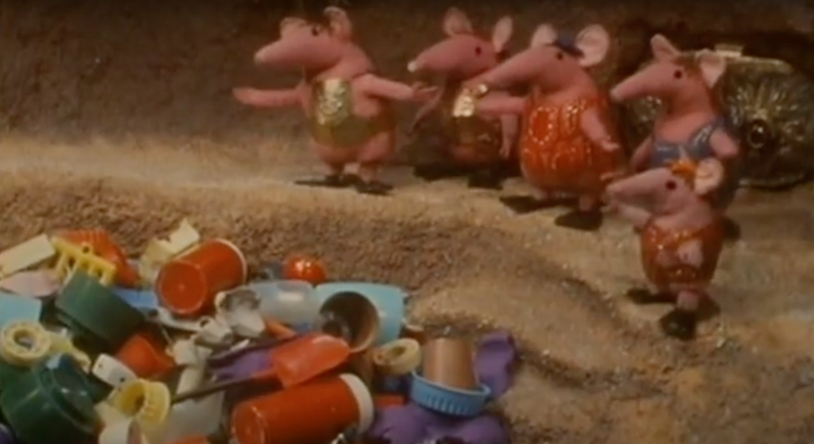  A row of Clangers contemplating a sea of plastic goods